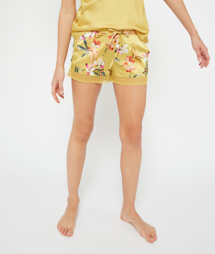 Satiny shorts in a floral print acidulous yellow.