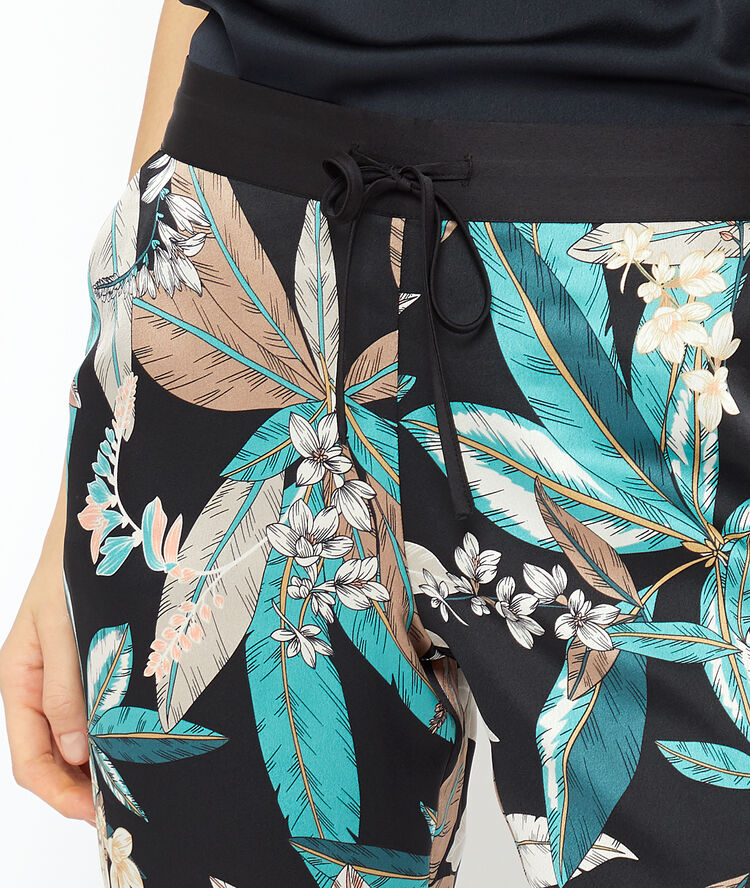 Foliage print trousers black.