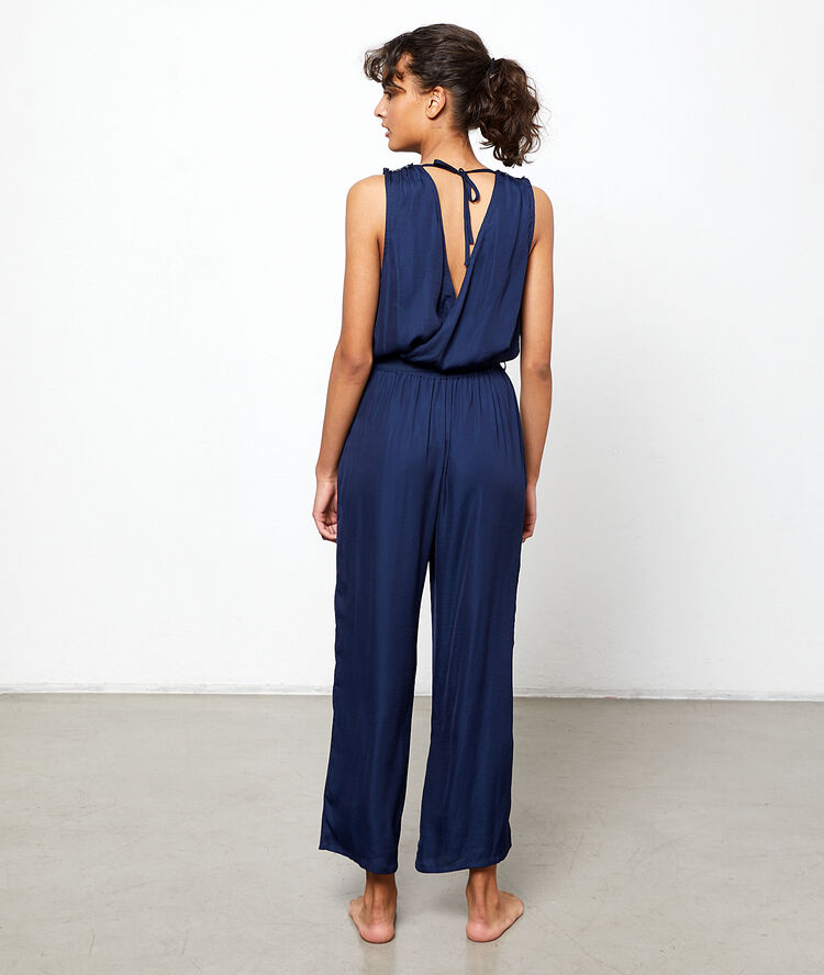 Satiny jumpsuit with a wrap style low cut blue.