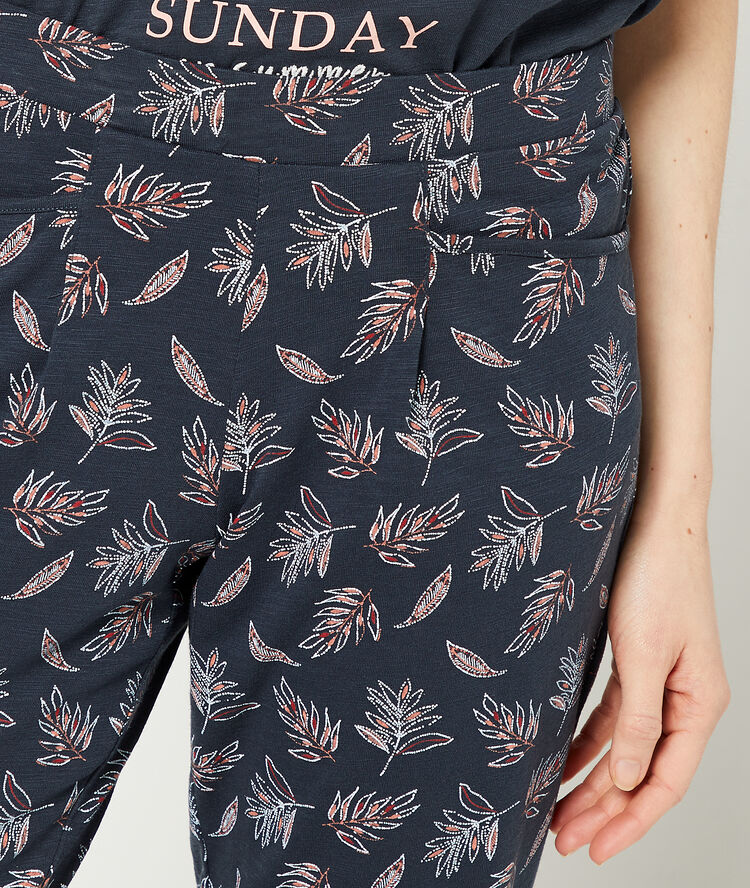 Crop trousers in a foliage print navy blue.