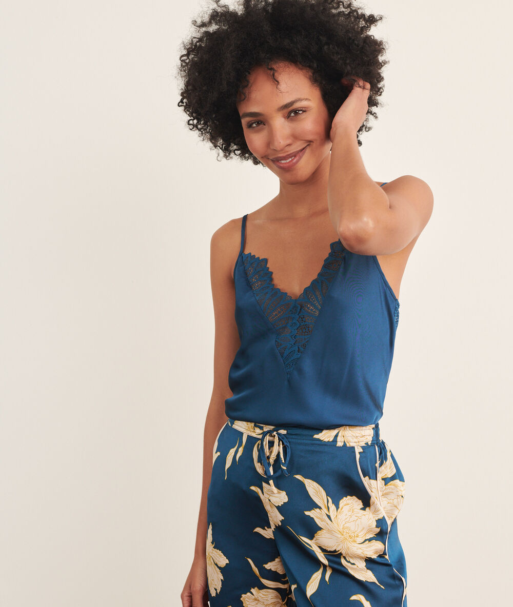 Satiny cami top with a lace trimmed low cut blue petroleum.
