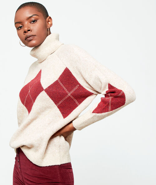 Pull col roulé à motifs jacquard ecru.