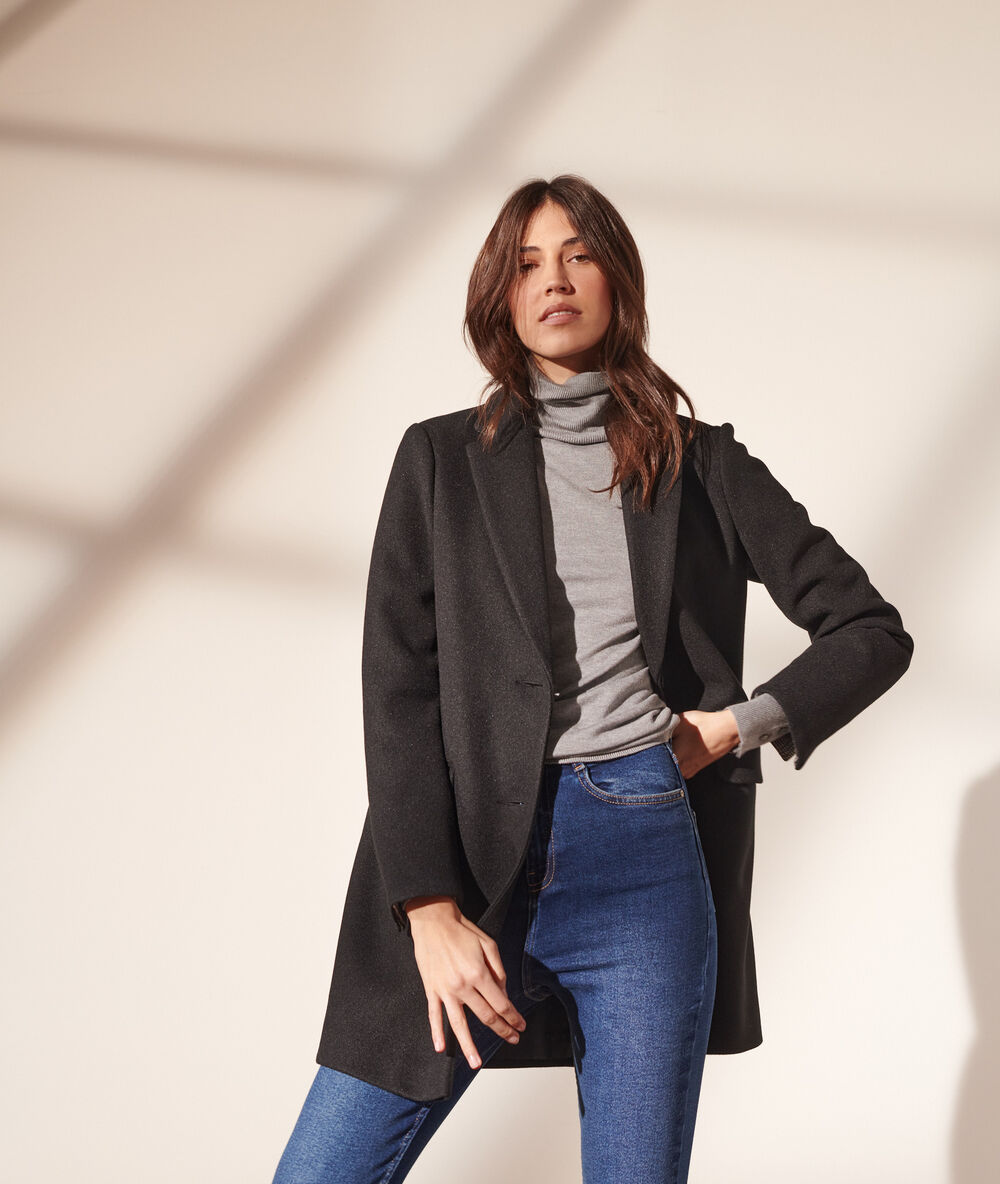 Straight-cut coat black.