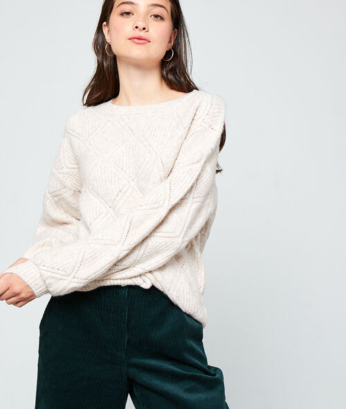 Pull en grosse maille grege.