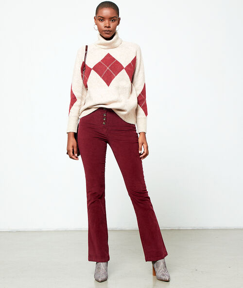 Pull col roulé à motifs jacquard ecru.