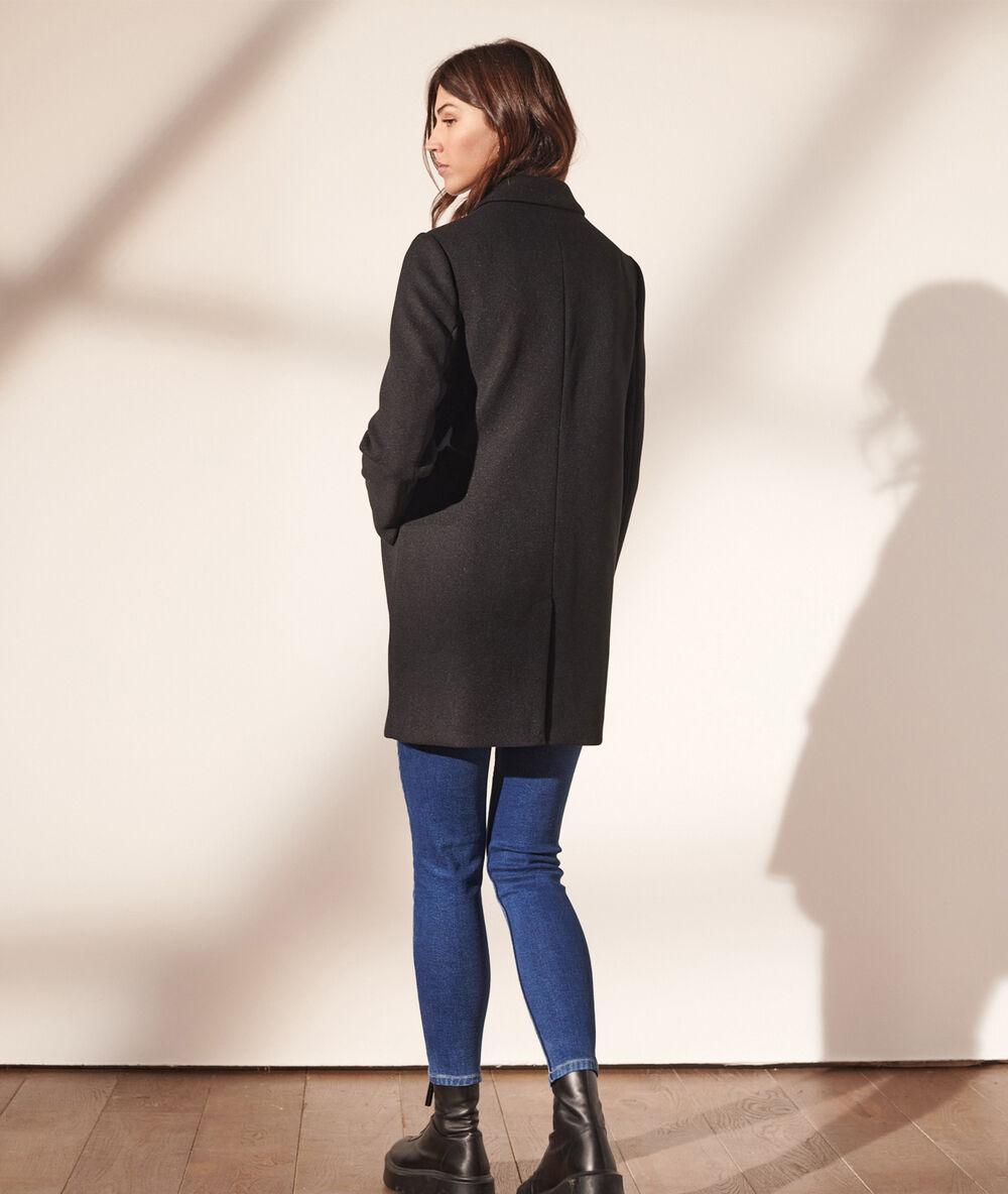 Straight-cut coat black.